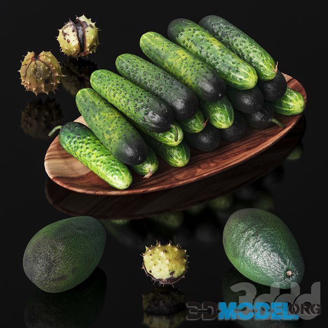 Cucumbers, chestnuts and avocados in a wooden bowl