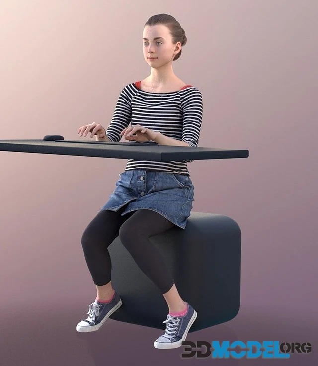 Young girl Mady sitting at her computer (3D Scan)