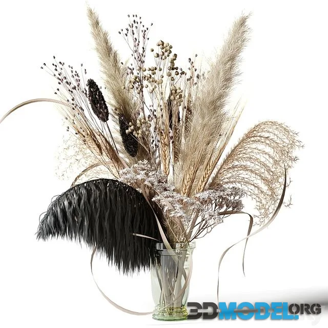 Bouquet of dried flowers with a black feather in a glass vase