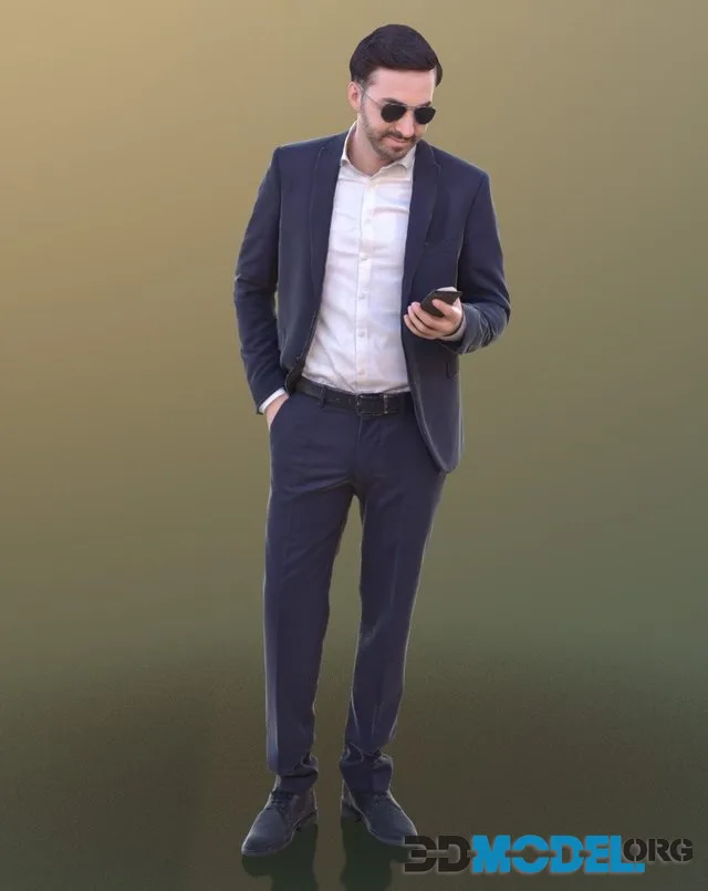 Anselmo man wearing black glasses stares into a smartphone